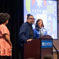 Dr. Shorty speaking at podium